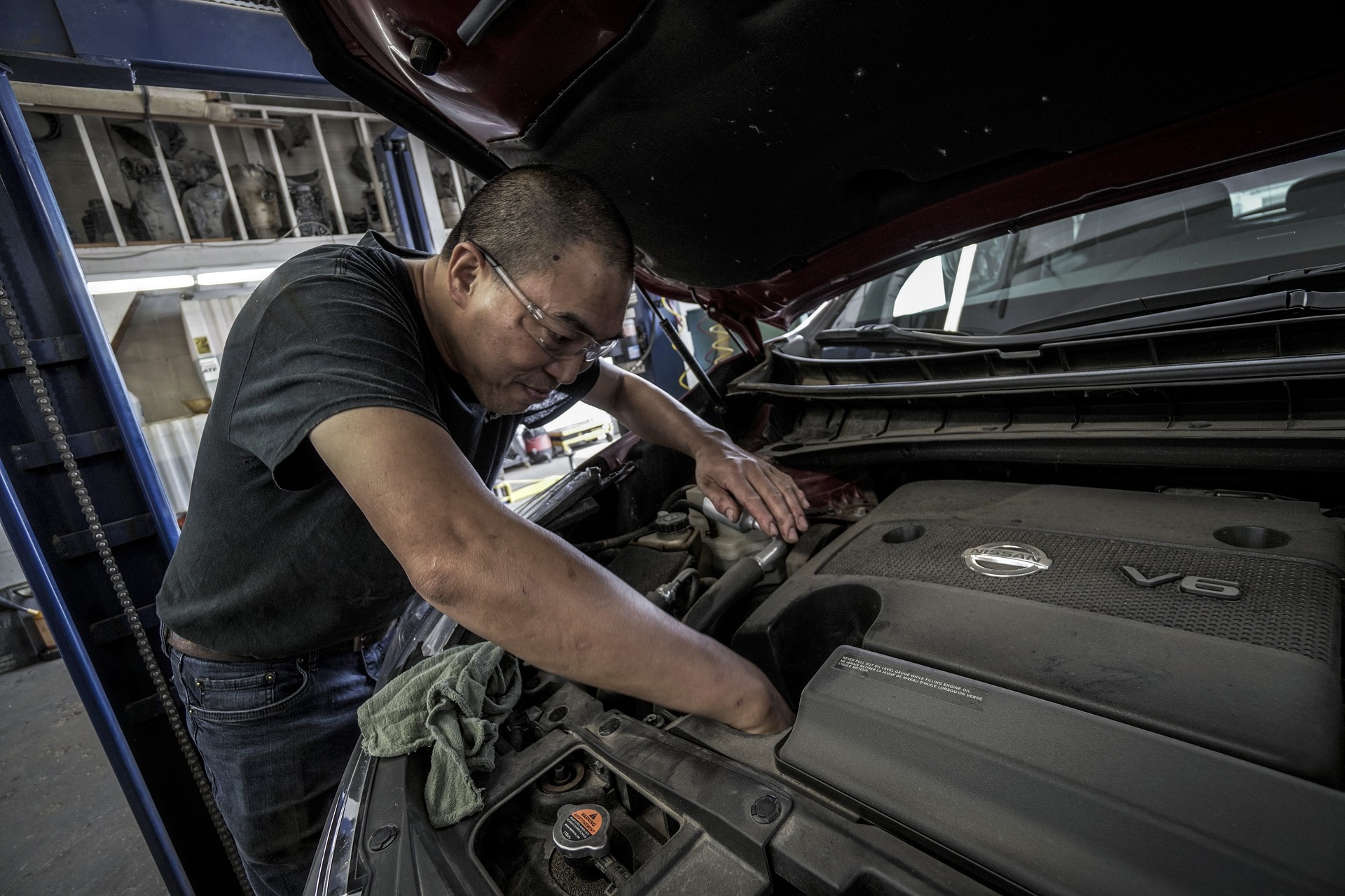A main repairing a car
