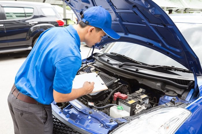 Man checking a car