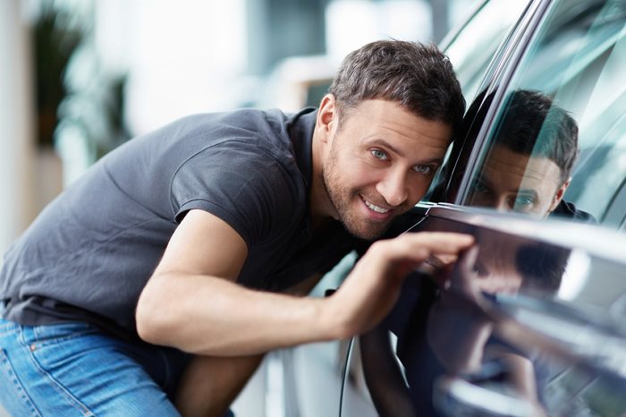 Man inspecting a car